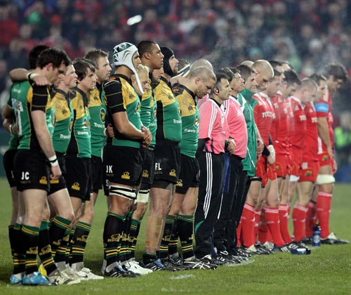 Munster and Northampton Saints observe a minute's silence before their pool decider in Limerick