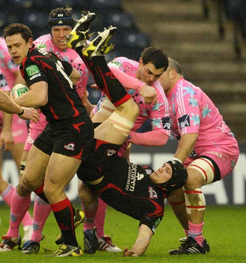 Nick de Luca looks for space as his Edinburgh team-mate Ross Rennie is upended