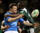 Leinster centre Brian O'Driscoll is clattered by Topsy Ojo