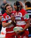 Gloucester's Akapusi Qera is congratulated on a try by Rory Lawson