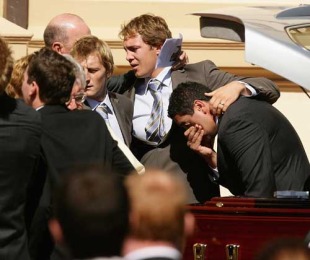 Patrick Phibbs, Stephen Hoiles and Morgan Turinui console each other at the funeral of Shawn Mackay, Mary Immaculate Church, Waverley, Sydney, Australia, April 15, 2009