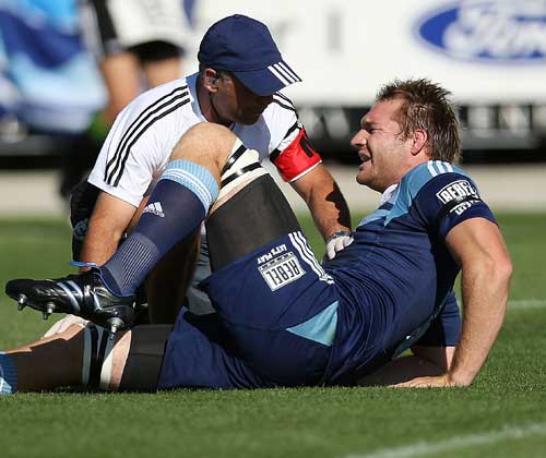 Blues lock Ali Williams receives treatment for an injury