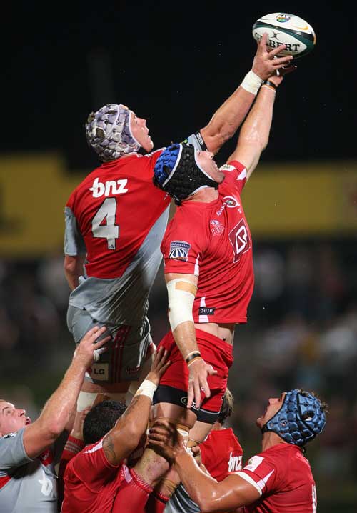 The Reds' Van Humphries and the Crusaders' Joe Wheeler compete for a lineout