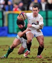 England Saxons scrum-half Micky Young is tackled by Ireland A's Isaac Boss