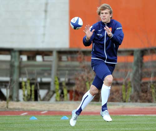 France wing Aurelien Rougerie catches the ball during training