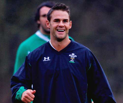 Wales Lee Byrne smiles during a training session