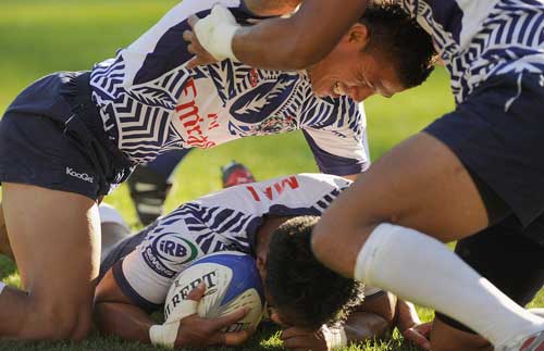 Samoa's Uale Mai is congratulated by his team mates after scoring against New Zealand