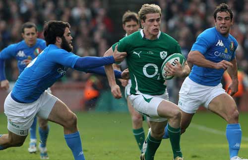 Andrew Trimble is tackled by Luke McLean