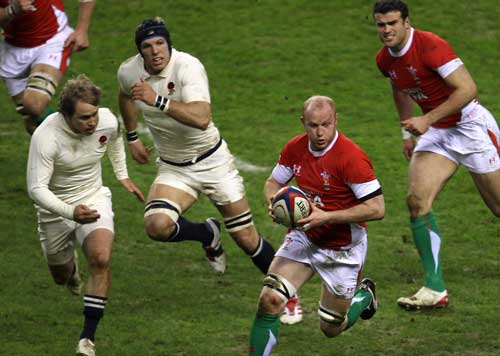 Martyn Williams takes on the England defence