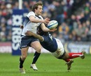 Scotland's Phil Godman is tackled by France's Mathieu Bastareaud