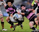 Wasps' Mark Robinson is tackled by the Newcastle defence