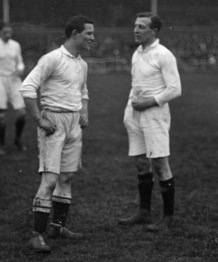 England's Adrian Stoop talks to a team-mate, November 2, 1911
