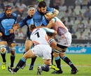 The Bulls' Danie Rossouw is tackled by the Cheetahs defence