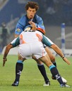 The Bulls' Zane Kirchner is tackled by the Cheetahs' Corne Uys