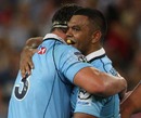 Kurtley Beale and Al Baxter celebrate the Waratahs' victory over the Reds