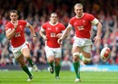 Wales flanker Andy Powell chases a bouncing ball