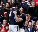 Max Evans is congratulated after scoring Scotland's second try