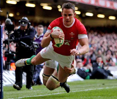 Wales' Lee Byrne dives over to score a try