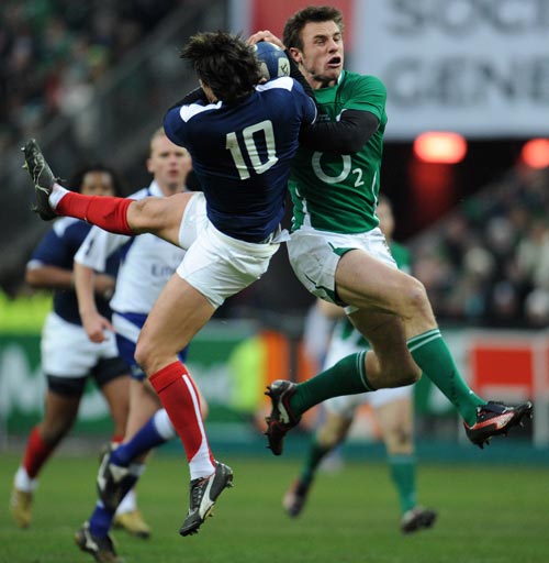 Tommy Bowe competes with Francois Trinh-Duc for a high ball