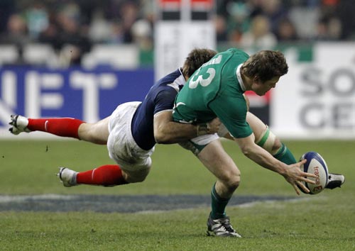 Ireland's Brian O'Driscoll loses control of the ball