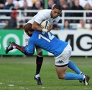 England's Delon Armitage is tackled by Italy's Gonzalo Garcia
