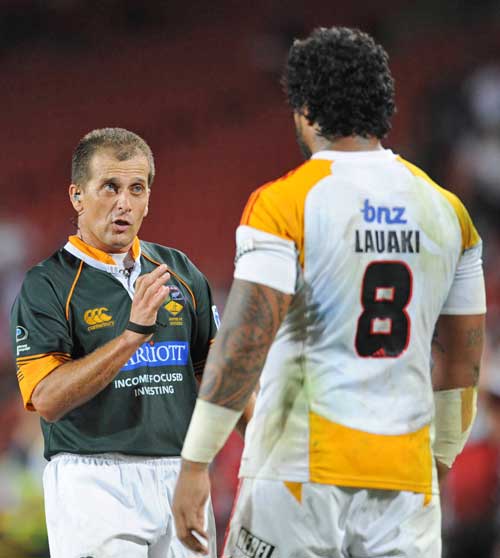 The Chiefs Sione Lauaki is lectured by referee Marius Jonker