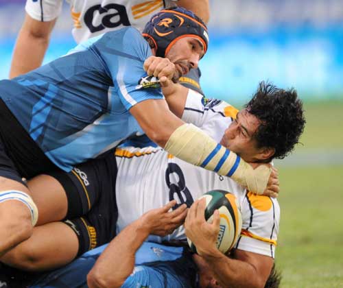 The Bulls' Victor Matfield tackles the Brumbies' George Smith