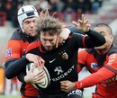 Toulouse fullback Maxime Medard is swamped by the Toulon defence