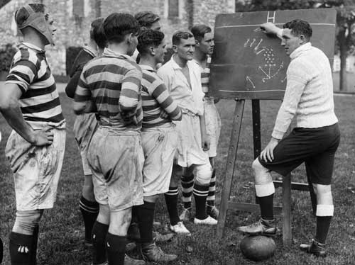 Wales' Vivian Jenkins discusses tactics with players at Dover College