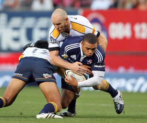 The Stormers Bryan Habana is tackled by the Brumbies' Stirling Mortlock
