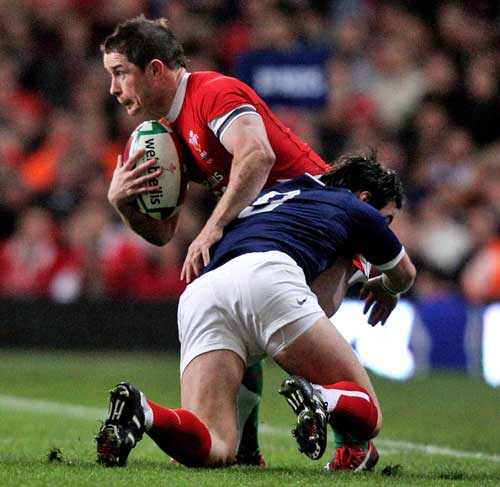 Wales' Shane Williams is tackled by France's Morgan Parra