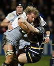 Newcastle flanker Adam Balding is halted by a Worcester tackle