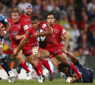 Will Genia breaks a tackle as he stars in a losing side, Reds v Blues, Super 14, Ballymore, Brisbane, Australia, February 27, 2010.