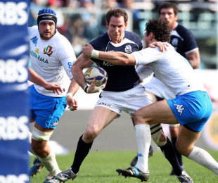 Scotland's Graeme Morrison tries to break a tackle with the posts in sight, Italy v Scotland, Six Nations, Stadio Flaminio, Rome, Italy, February 27, 2010