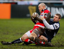 Gloucester centre Mike Tindall is taken down by Sale wing Ben Cohen