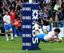 Italy scrum-half Pablo Canavosio dives over for the game's decisive score