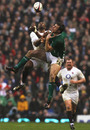 Tommy Bowe competes for a high ball with fellow winger Ugo Monye