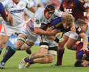 Adam Thomson is tackled by David de Villiers