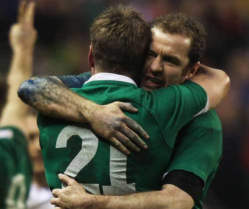 Ireland fullback Geordan Murphy embraces Ronan O'Gara following their victory over England