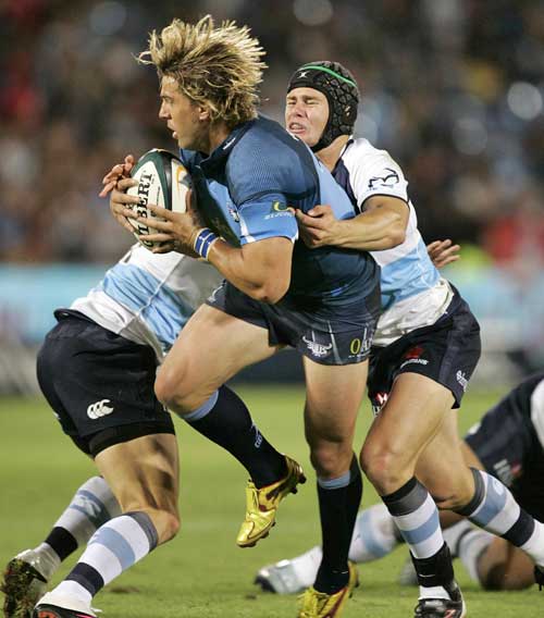 The Bulls' Wynand Olivier stretches the Waratahs' defence