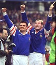 France's David Venditti and Olivier Magne celebrate victory over England