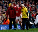 Wales hooker Gareth Williams is helped from the field