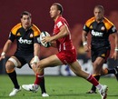 The Reds' Quade Cooper looks for a hole in the Chiefs' defence