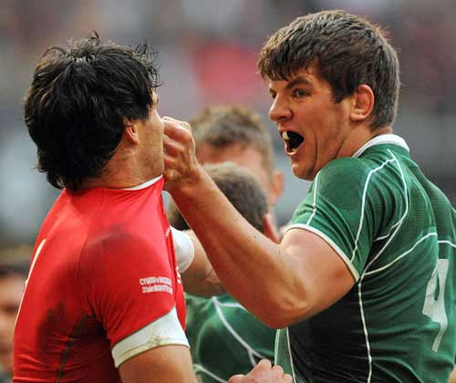 Ireland's Donncha O'Callaghan gets to grips with Wales' Mike Phillips