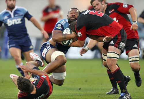 The Blues' Viliami Ma'afu is felled by the Crusaders' defence