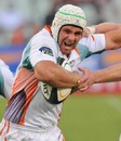 The Cheetahs' Heinrich Brussow fends off the Highlanders' defence