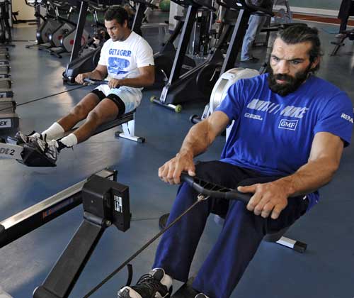 France lock Sebastien Chabal and skipper Thierry Dusautoir work out during a gym session
